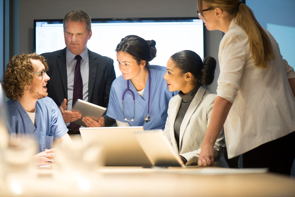 medical team hear presentations from business